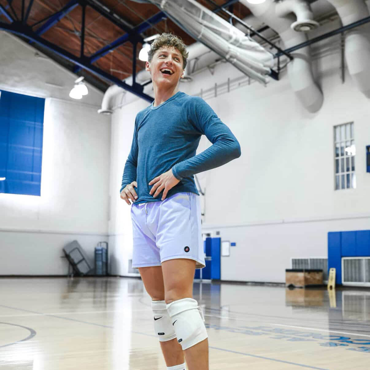 Person in athletic wear standing in a gymnasium