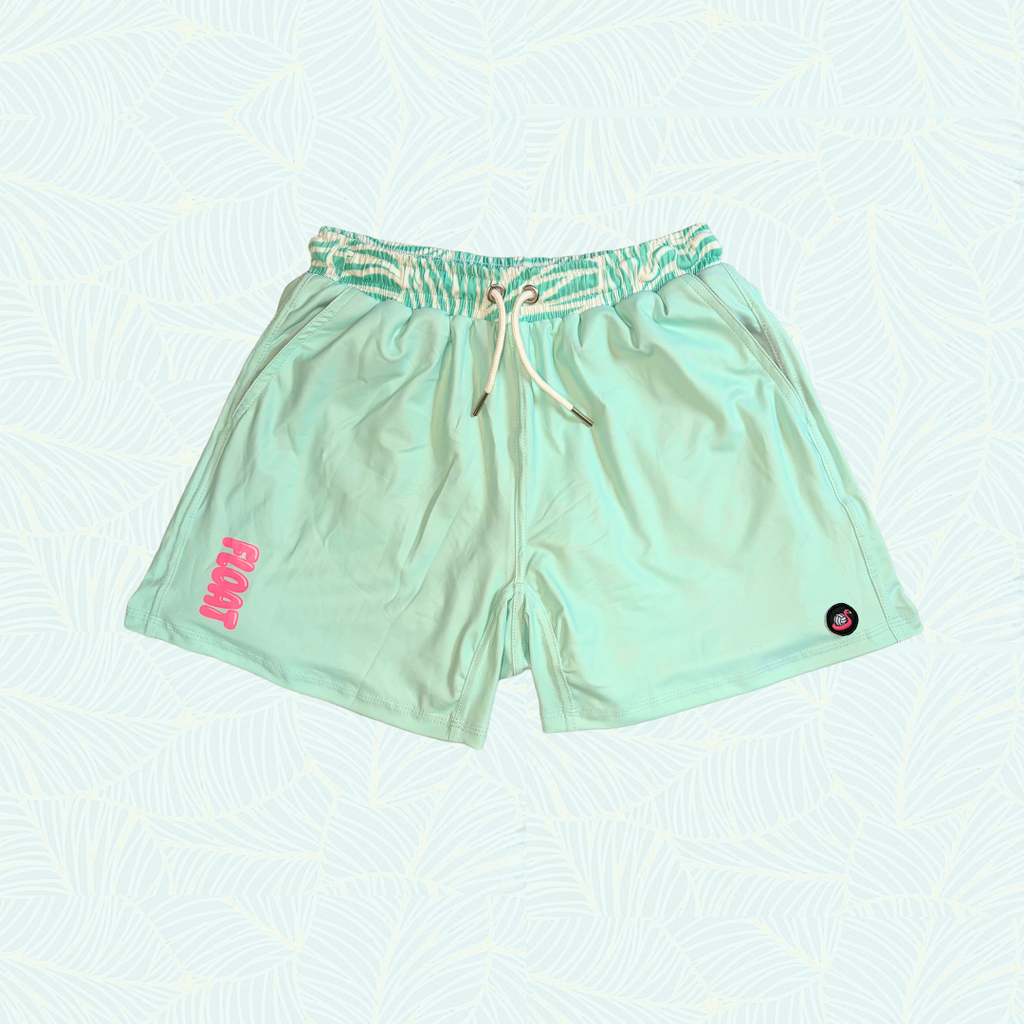 Light green shorts with a small pink logo on a light blue background