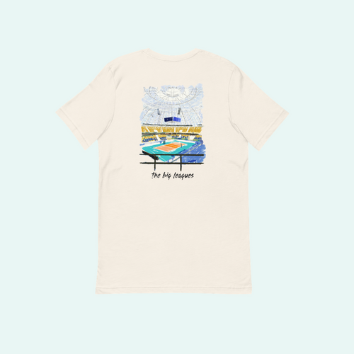 An off-white short-sleeve t-shirt shown from the back, featuring a colorful graphic illustration of a stadium and the text 'The Big Leagues' printed below it.
